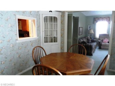 DINING AREA WITH BUILT IN CORNER CABINET