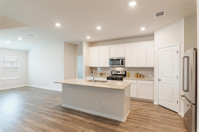 Kitchen featuring a sink, appliances with stainle