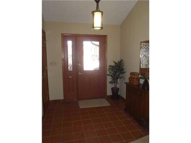 Entry. Spacious front entry with tile flooring, large closet and cathedral ceiling.