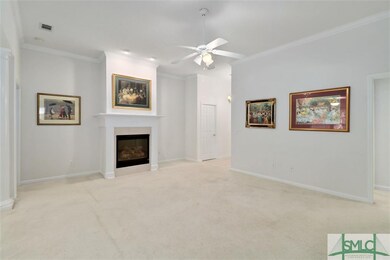 Large family room with gas fireplace is open to th