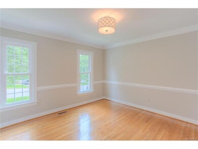 Elegant dining room with crown molding and chair r