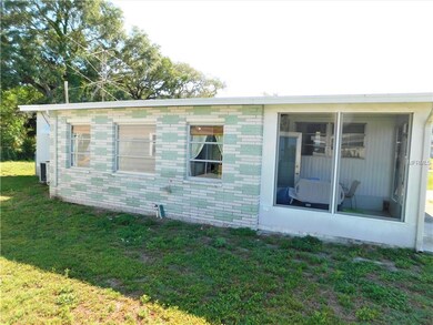 Side of home with Florida room.