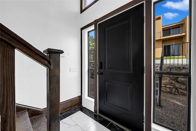 Entryway with marble finish floor
