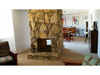 Property Photo. Note two-sided fireplace that HAS