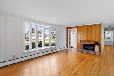 Living room with hardwood floors and wood burning