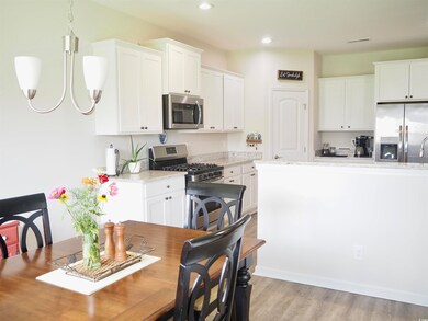 Interior space featuring light stone counters, han