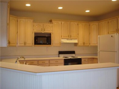 Kitchen. KITCHEN WITH LOTS OF COUNTER SPACE AND PLENTY OF ROOM FOR ENTERTAIING. LARGE BREAKFAST BAR