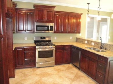 Beautiful Pendant Lighting is a great accent over the bar area;  Frigidare Gallery Stainless Appliances, 