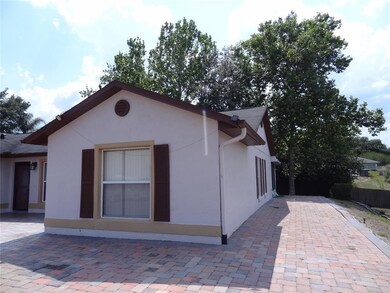 Extended paver in front and side of home.