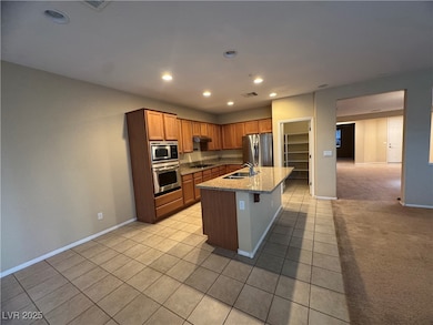 Kitchen with recessed lighting, light tile pattern