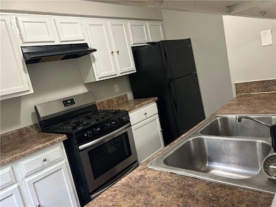 opening under cabinets in kitchen to eating area