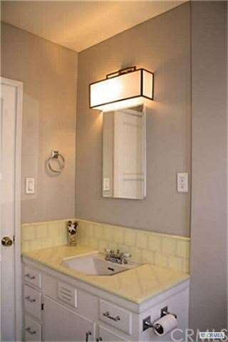 Bathroom with new tile floors, new shower door, an
