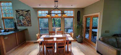 Dining Room opens to Kitchen, Great Room, & 16 X 16 Screen Porch.