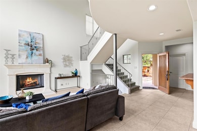 Living room with light tile patterned flooring, s