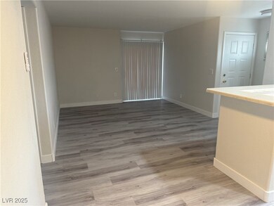 Empty room featuring wood finished floors and base