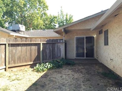 Back yard facing Unit A's patio and sliding glass 