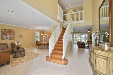 Enter to foyer with grand 24 foot ceiling.