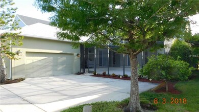 Screen Enclosed Patio with Lanai surrounded by a variety of beautiful trees, with an herb garden bed, a Meyer Lemon Tree to nurture and grow... splendid location!