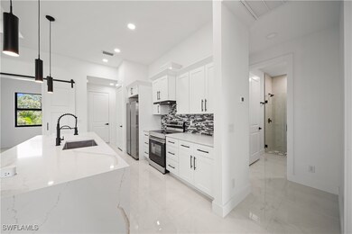 Kitchen featuring a sink, appliances with stainles