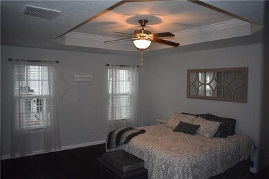Master bedroom with trey ceiling