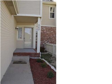 Landscaped entrance and Storm Door.