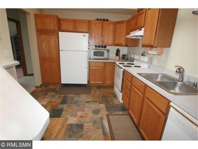 Beautiful slate flooring compliments the oak cabin