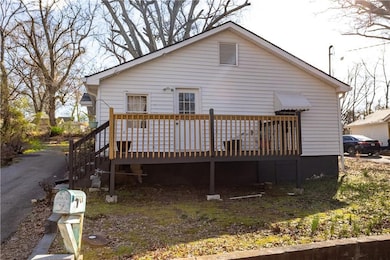 Back of property featuring a deck