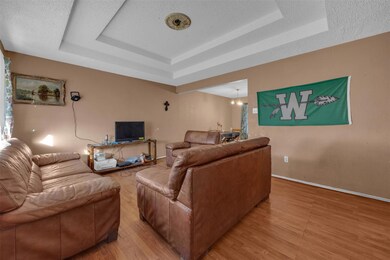 Living room with hardwood / wood-style flooring, a