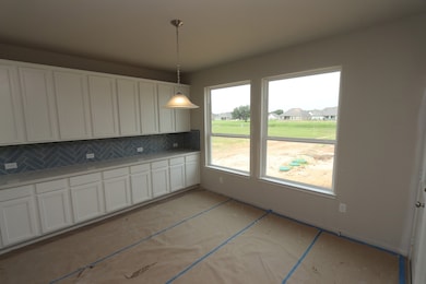 Charming dining area with extended cabinetry