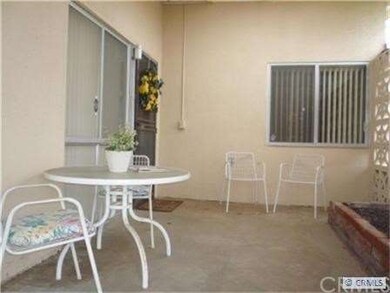 Side Patio with Entrance to Unit
