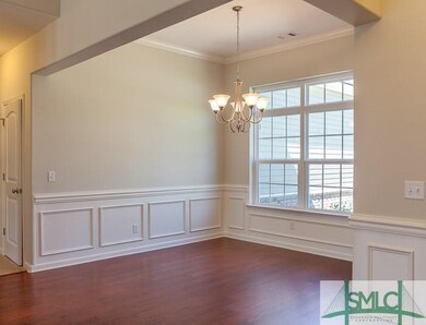 Elegant separate dining room with wainscoting, dou