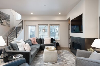Living Room with Gas Fireplace & Balcony