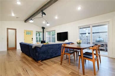 The living area has access to the side yard.