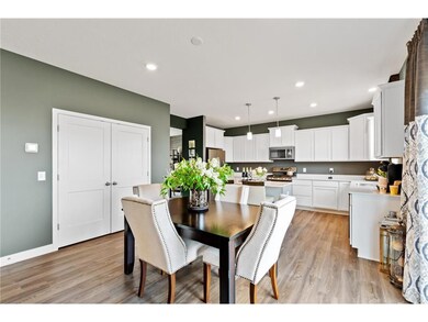 The informal dining room has ample room for a dining table located in the heart of the home, with close proximity to the nicely sized double door pantry. (Images of Model Plan, Finishes Will Vary)