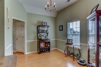 Host the finest dinner parties in the romantic dining room embellished with a dazzling chandelier, gleaming hardwood floors, soaring ceiling, and a chair rail.