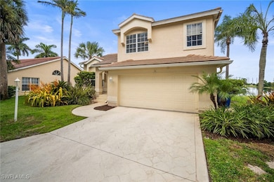View of front of property featuring concrete driveway, an attached garage, a tiled roof, stucco siding, and a front yard