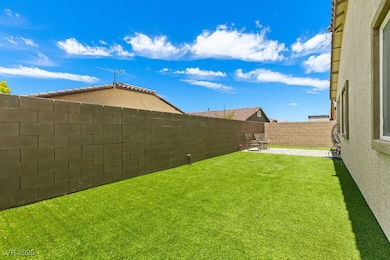 Fenced backyard with a patio