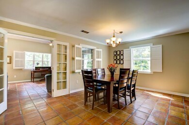 Dining room is off of living room, each window off