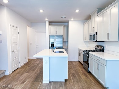 Kitchen featuring appliances with stainless steel