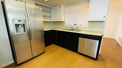 Kitchen featuring stainless steel appliances, a s