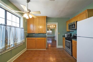 Spacious kitchen complete with appliances.