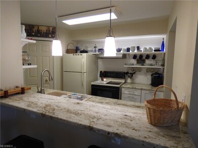 View of Updated Kitchen with Bar Seating