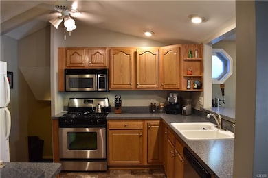 Spacious kitchen with breakfast bar looking into t