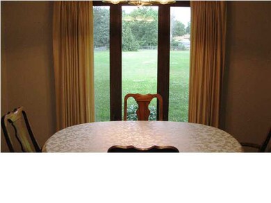 Formal dining room overlooks the backyard.