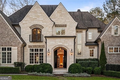 This inviting front porch creates a warm and welcoming first impression with handmade bricks from Alabama and limestone
