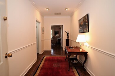 Entering the condo foyer. Formal living room strai