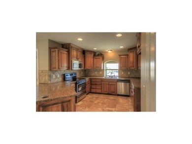 Beautiful Cabinets....arched window over the sink 