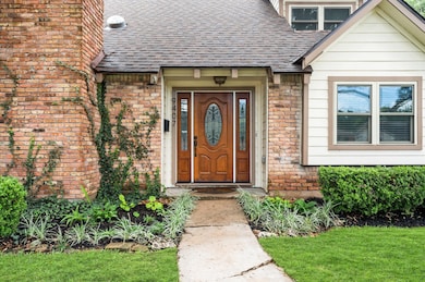 The front entrance highlights a beautiful wooden d