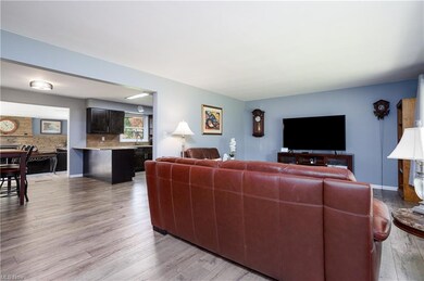 Open floor plan shows living room, dining room and