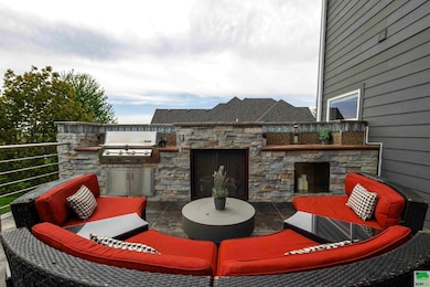 Off of the kitchen~ fireplace, built in grill ~ be